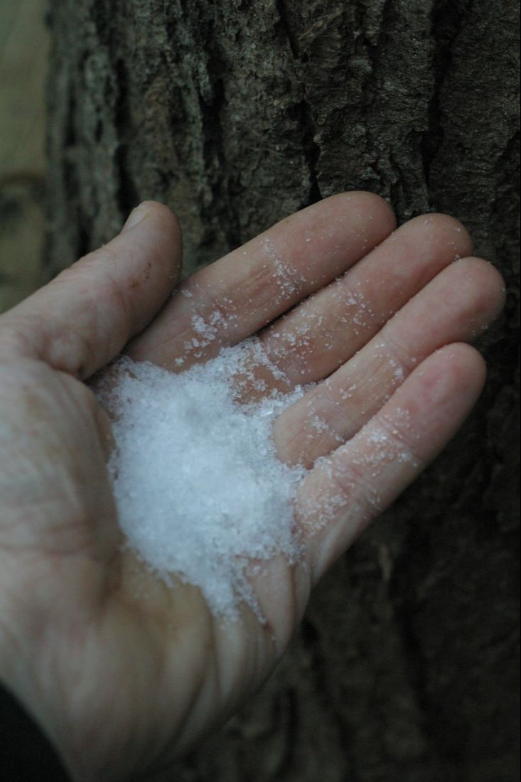 A hand holding epsom salts